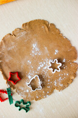 Dough for ginger cookies with Christmas molds.