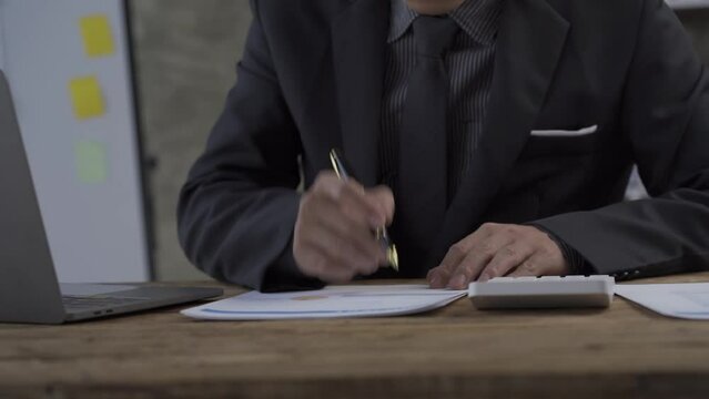 Accountants work on financial and tax reports. financial calculations and management Calculation of revenue or estimated profit Accountant Hand Working On Calculator And Making Financial Report 4K