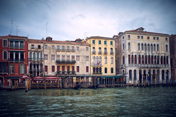 Fototapeta na wymiar Traditional venetian houses and architecture style view across the Grand Canal in Venice, Italy