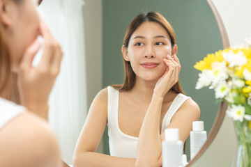 Freshness, nice healthy. Beautiful asian young woman, girl looking on reflection in mirror, hand...