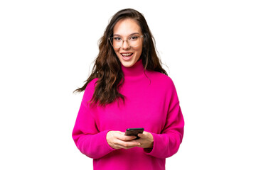 Fototapeta premium Young caucasian woman isolated over isolated background surprised and sending a message