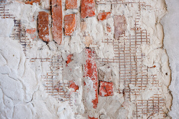 part of the decor and the material from which it is made;
red brick under old plaster

