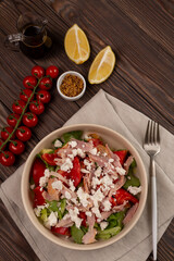 Mix of lettuce leaves with smoked chicken meat, tomatoes and salted soft cheese, with mustard-lemon dressing