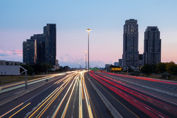 Speed traffic, light trails on freeway at night, long exposure abstract urban background. Toronto...