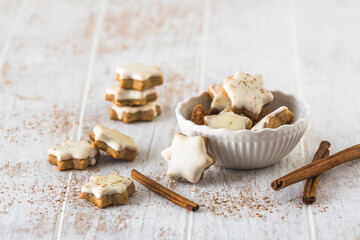 Christmas cinnamon star cookies on a wooden table