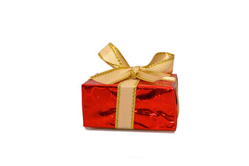 Red gift box with yellow bow. On a white background.