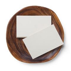 stack of business cards and a single one (for front and back design) European size on a wooden...