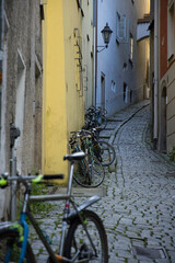 Fototapeta na wymiar Bicycles in an old alley in Passau, Germany 