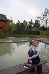 young woman by the pond