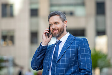 phone conversation of happy businessman. businessman with phone has conversation.