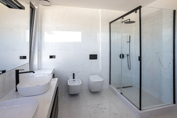 Fototapeta na wymiar white marble bathroom with window, shower, toilet, bidet and sinks