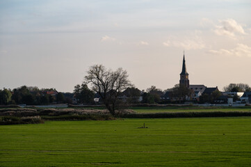 Berlare, East Flemish Region, Belgium,  View over the green meadows and the village in the...
