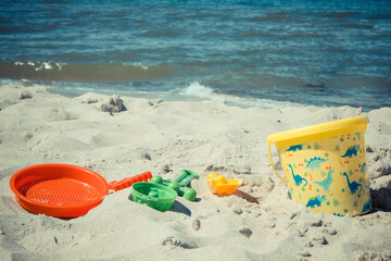 Fototapeta na wymiar Children toys for relax or playing at beach. Summer, vacation time and child development