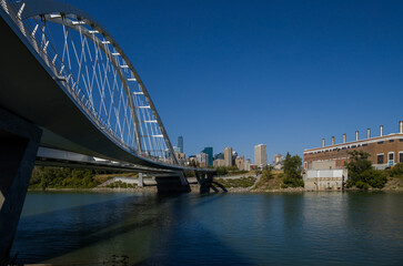 Modern arc bridge over the river,  day traffic, summer time. modern architecture, panorama of the city Edmonton