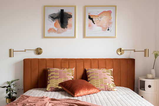 Elegant bedroom with bed with velvet headboard
