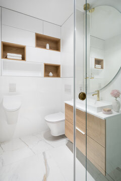 Stylish white bathroom in marble and wood