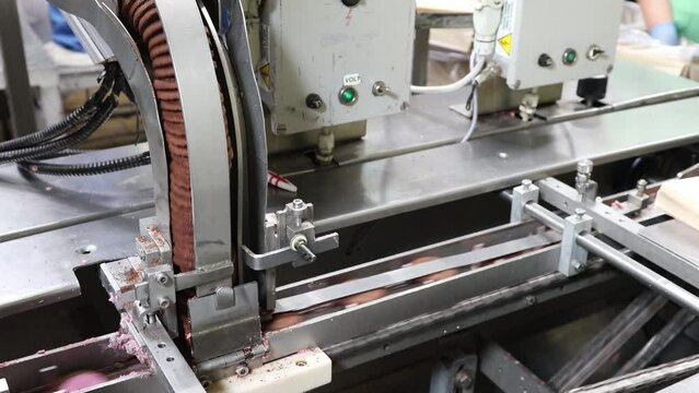 the conveyor at the sweet cookie factory is in operation
