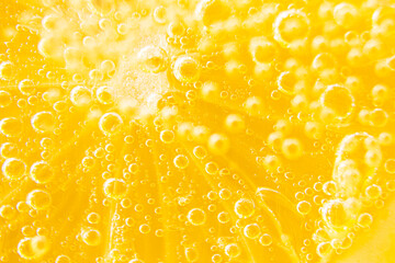 Lemon texture, macro. Abstract yellow summer background.