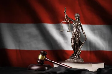 Zelfklevend Fotobehang Austria flag with statue of lady justice, constitution and judge hammer on black drapery. Concept of judgement and guilt © mehaniq41