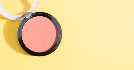 One tonal powder box for the face on yellow.