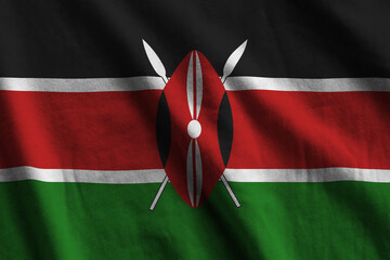 Kenya flag with big folds waving close up under the studio light indoors. The official symbols and...