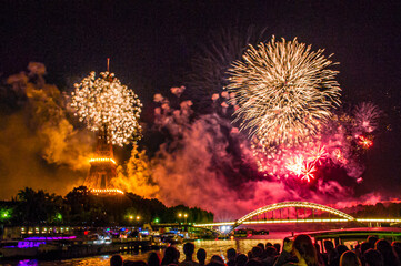 Fireworks over the Seine in Paris, France on Bastille Day. - obrazy, fototapety, plakaty