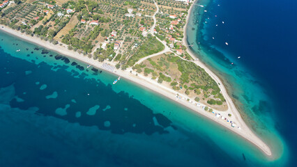 Aerial drone photo of tropical exotic paradise volcanic island complex bay with deep turquoise sea forming a blue lagoon archipelago visited by luxury yachts and sail boats