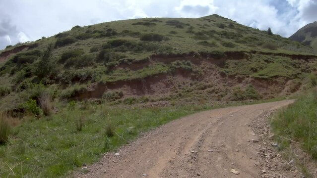 Song-Kul, Kyrgyzstan - May 2022: Point of View driving hyper lapse in 33 Parrots road, a zig zag route climbing towards Song-Kul Lake. Route and nature, travel concept dashcam POV in Kyrgyzstan
