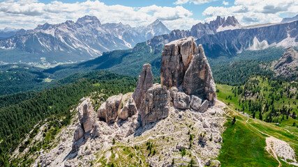 Climbing in Cinque Torri,Dolomites,Italy.Five towers and rock formations close to Cortina d'Ampezzo attract many tourists.Picturesque Dolomite Alps,active summer holiday,steep cliffs.Adventure concept
