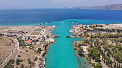 Aerial drone photo of yacht crossing narrow Corinth canal of Isthmus from West submersible bridge and narrow opening of Corinthian gulf to Saronic gulf, Loutraki, Greece