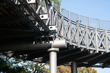 pedestrian overpass: pillar, steel structure, the base with a steel plate, with supports, flanges,...