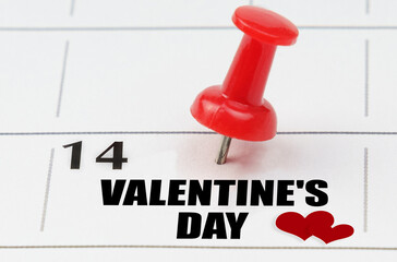 On the calendar grid, the date and name of the holiday - February 14 - Valentine's Day