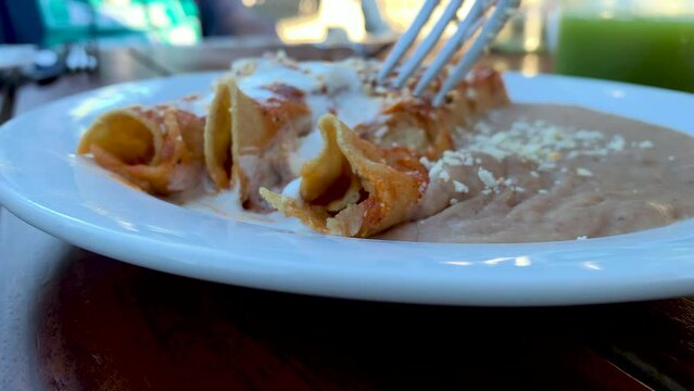 Eating a Plate of Enchiladas