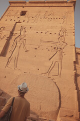traveler admiring Philae Temple Egypt