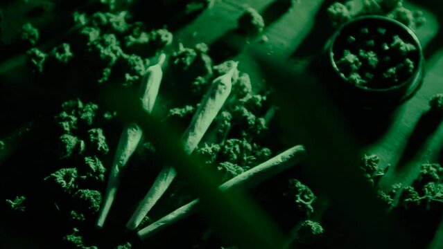 Drugs and marijuana, sbd or thc bumps. Sativa and indica in green neon. Weed and smoking plants, laboratory. Grinder and joints with pipe.