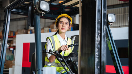 Warehouse worker working with a forklift in a warehouse or storehouse.