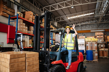 Warehouse worker with a forklift in the warehouse or storehouse., Industrial and industrial concept.