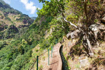Fototapeta na wymiar Hiking trail along Levada Nova hike tour on Madeira island in Portugal