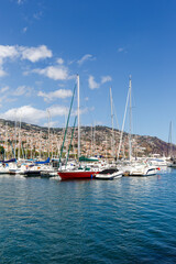 Fototapeta na wymiar Marina with boats in Funchal on Madeira island portrait format in Portugal