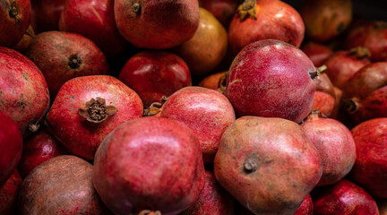 Pile of pomegranates in a store.
