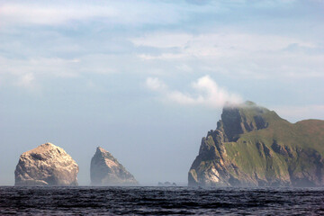 Fototapeta na wymiar Steep cliffs of St Kilda. The Saint Kilda archipelago contains the largest colony of Northern gannets in Europe with more than 60 000 nests