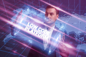 Business, Technology, Internet and network concept. Young businessman working on a virtual screen of the future and sees the inscription: Low code platform