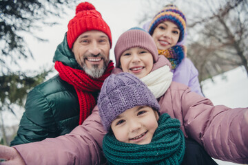 Obraz premium Photo of pretty dreamy husband wife small kids wear windbreakers embracing recording video vlog blog together outside urban city park
