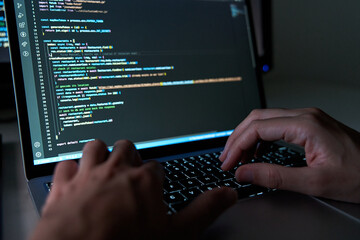 developer coding in laptop. Programming software concept
