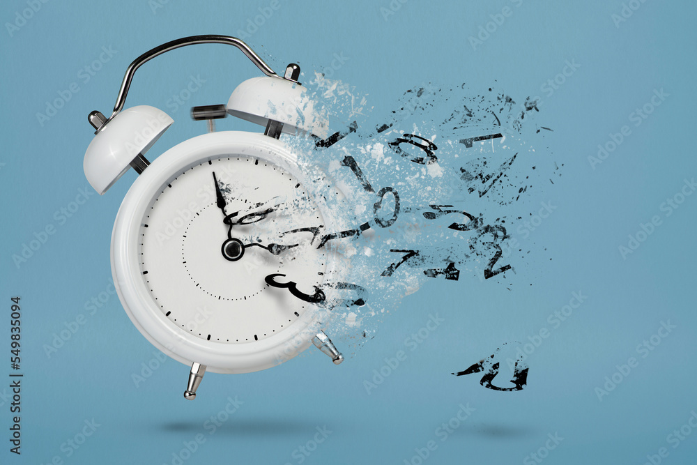 Wall mural time is running out. white alarm clock with flying numbers as a symbol of lost time. the concept of 