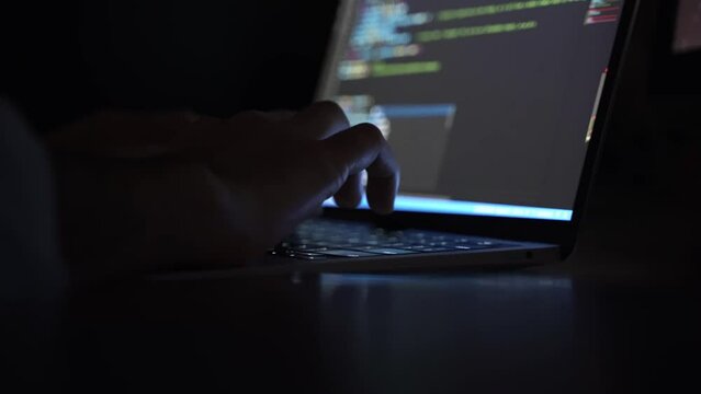 Hands writing code on laptop. Web and software development