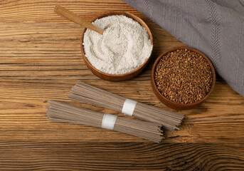 Buckwheat Flour Pile in Wood Bowl, Dry Buck Wheat Powder, Buckwheat Flour on Wooden Rustic Background