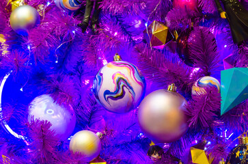 purple christmas tree with christmas decorations