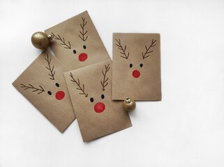 Christmas kraft envelopes with funny deer, idea for decorating gifts for Christmas and Advent calendar, copy space