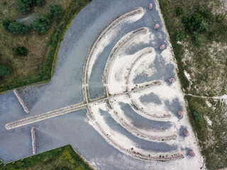 Aerial view of Memorial to the Holocaust Victims. Shape of Israel’s national symbol – the menorah or the seven-branch lampstand. Skede, Latvia.